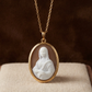 Gold necklace with a pendant featuring the mona lisa white silhouette carved by hand from sardonyx sea shell