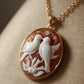 Vintage-style cameo necklace with two doves on a branch