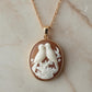 Necklace with a pendant featuring two birds on a branch 