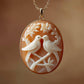 Carved cameo sea shell pendant with birds on a gold chain 